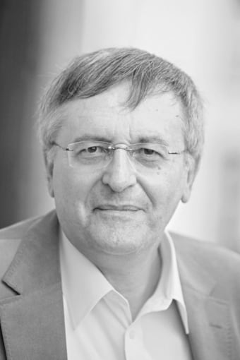 Porträtfoto John Gray